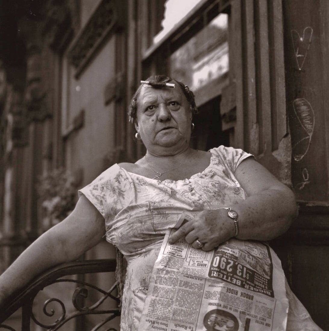 VIVIAN MAIER - Untitled (Woman with Newspaper): Artist: VIVIAN MAIER Print Title: Untitled Medium: Duotone Photolithograph Printed 2010’s in China Image size (inches) approx. 9 x 9” COA Included Reserve: $40.00 Shipping: Dome