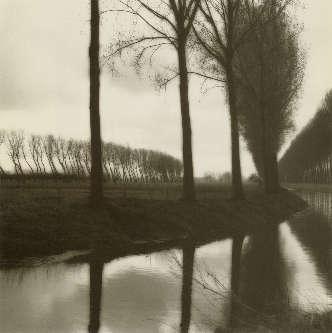 LYNN GEESAMAN - Damme, Belgium, 1992: Artist: Lynn Geesaman Title: Damme, Belgium, 1992 Medium: Photo Litho, 1998, Italy Dimensions: 8.3x8.3" Description: Heat Wax Mounted on 11x14" Conservation Board Artist Bio: Trained as a scientist, L