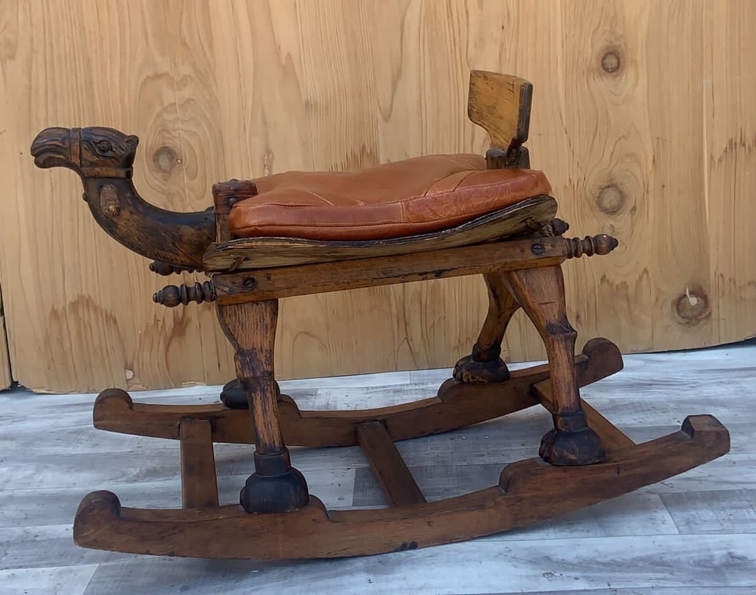 Vintage Turkish Design Carved Wood Rocking Camel: Vintage from the 1930s Materials: leather, wood " Antique Hand Carved Turkish Wood Camel Rocker with Leather Cushion Seat One of a kind and unique carved wood rocking camel. It’s a child’s