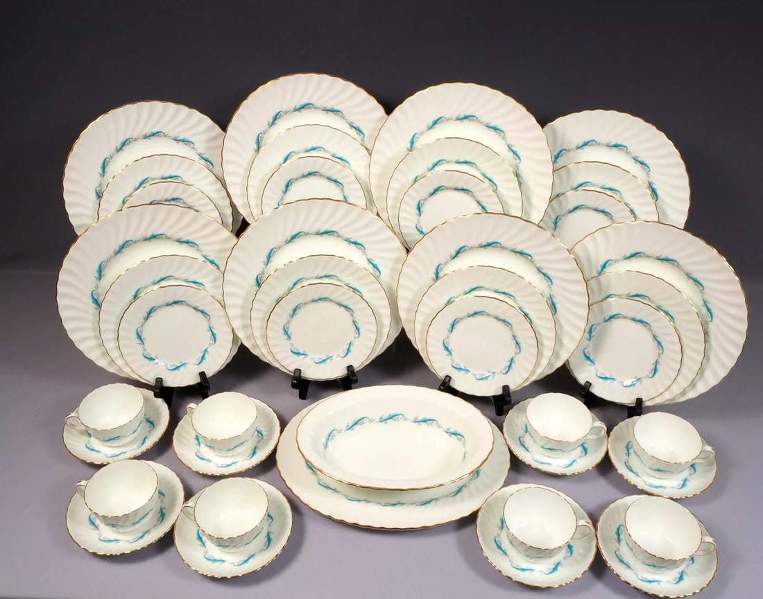 Minton DOWNING Dinner Set Plates Cup Saucer S 665 Swirl Rim Gold Edge Fife Shape: This is one gorgeous Bone China Dinner set for 8 (eight) with Serving pieces, from DOWING collection by Minton - Made in England. The pattern is with swirling shape, gold edge and aqua scrolls. The se