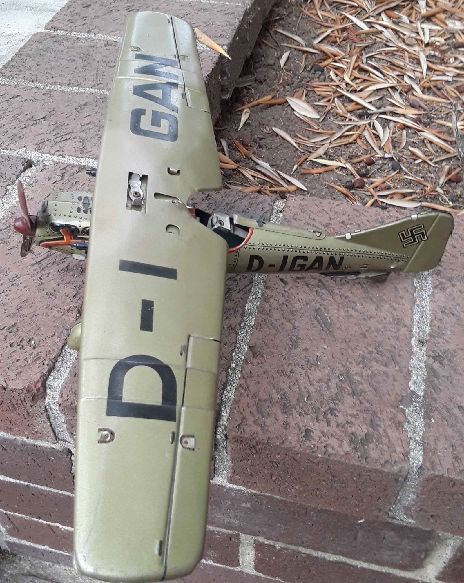 Tippco (made in Germany during WWII) military plane , complex windup motor drives landing gear (1 of 4)