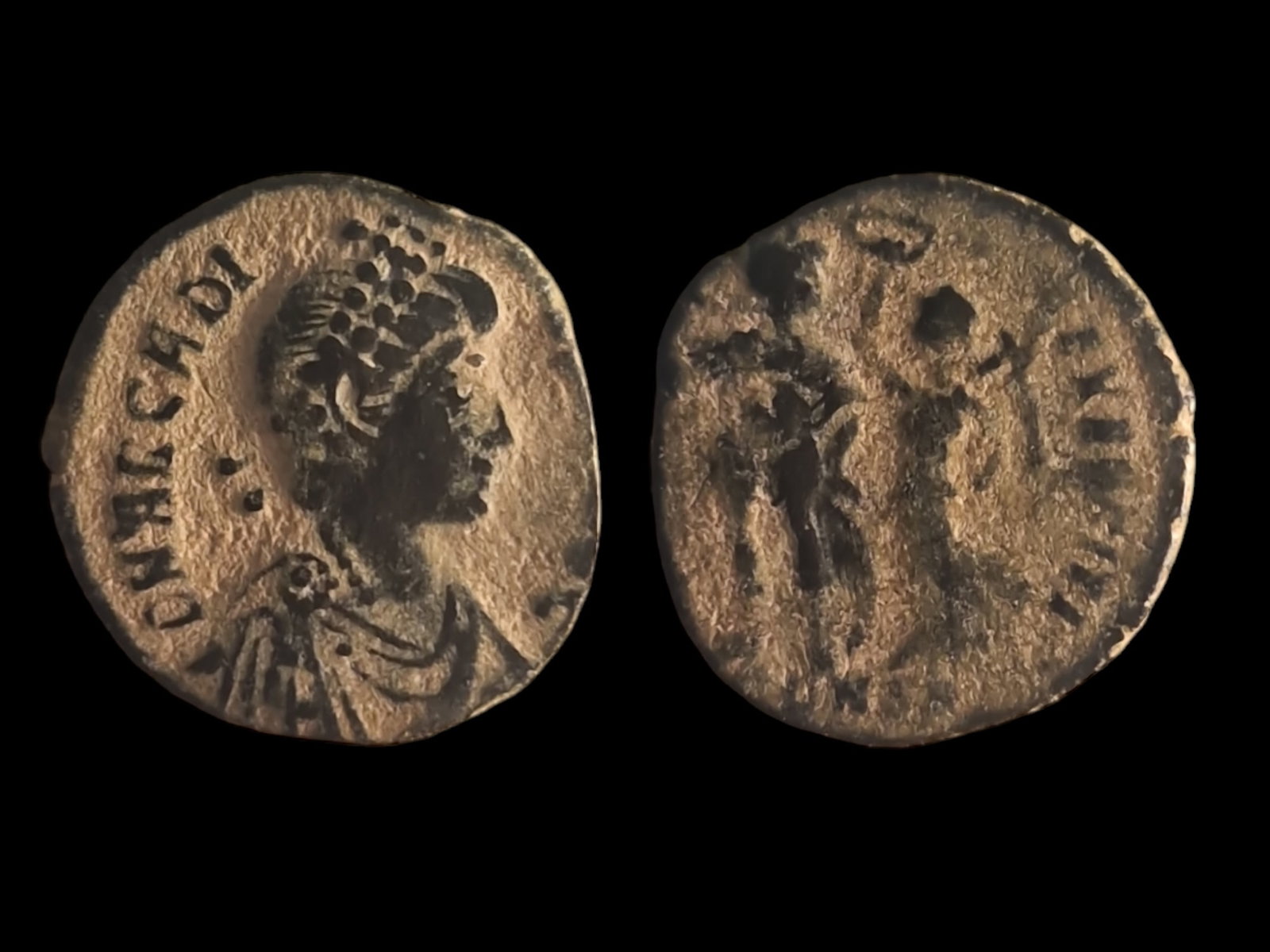 Roman Empire - Theodosius I (379-395 AD): Title: Roman Empire - Theodosius I (379-395 AD) Description: Obverse: Bust of Theodosius I. Inscription: "DN THEODOSIVS PF AVG." Reverse: Two soldiers standing, holding spears and shields Date/Period: