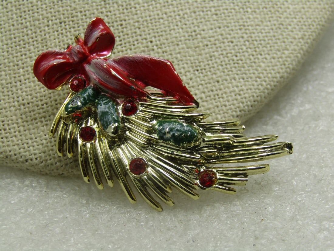 Vintage Christmas Branch Brooch, Enameled Bow & Rhinestones, 1950's-1960's: Vintage Christmas Branch Brooch, Enameled Bow & Rhinestones, 1950's-1960's. The bow is enameled in red with the hint of snow with white enameling brushed on the bow, green enameled pinegones in the go