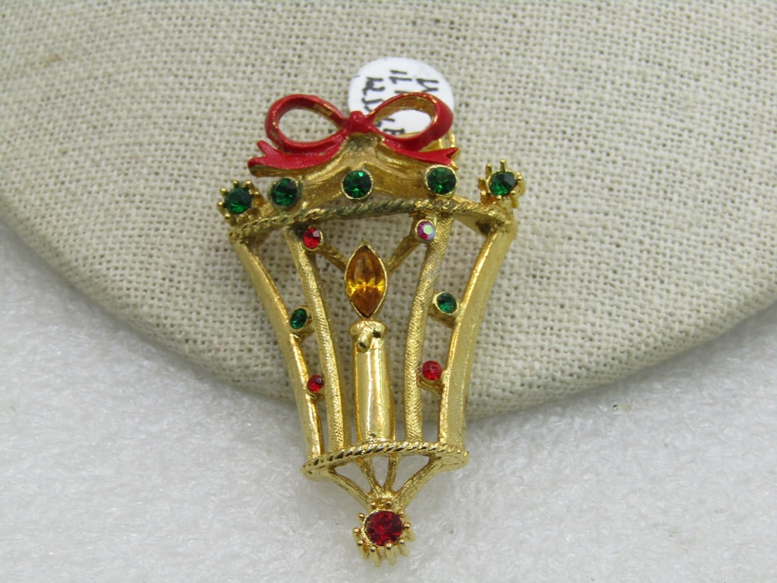 Vintage Christmas Rhinestone Lantern Brooch, Signed B.J., 1960's: Vintage Christmas Rhinestone Lantern Brooch, Signed B.J., 1960's, 2.25". Very good condition. (INV.W.11.1.12.516.A.3) Reserve: $15.00 Shipping: Domestic: Flat-rate of $6.00 to anywhere within the