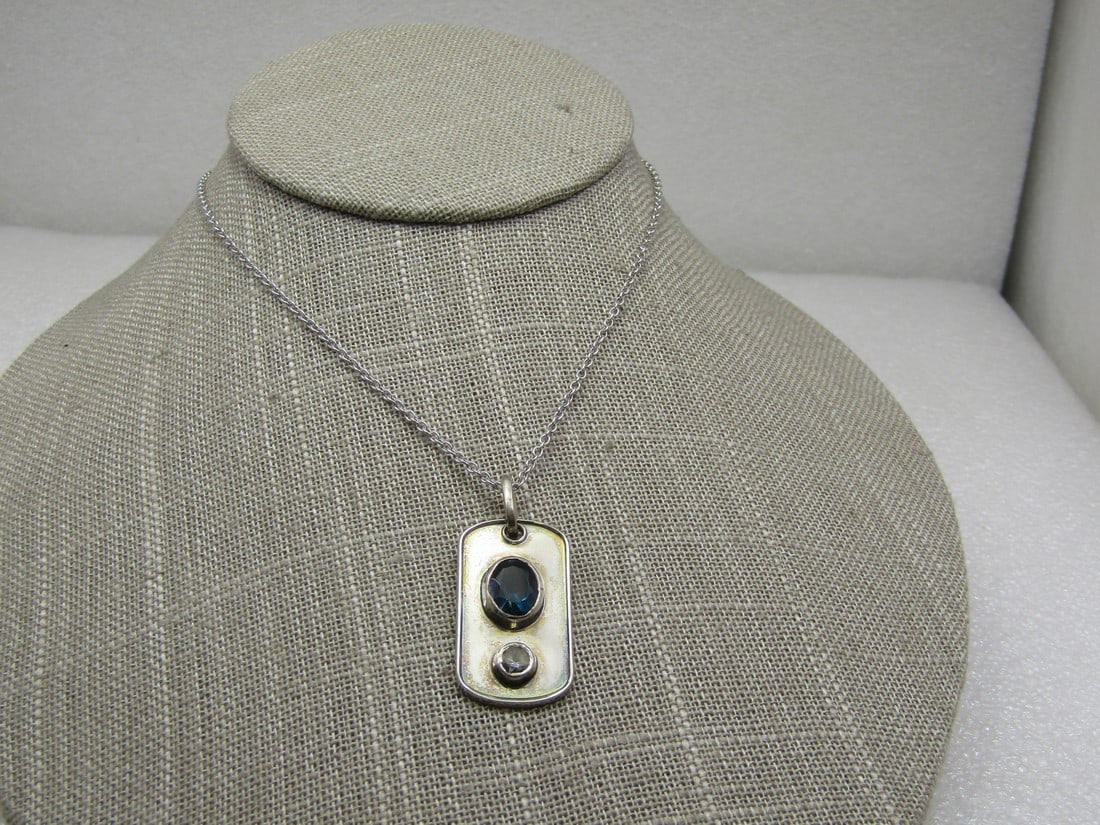 Vintage Sterling Spinel & White Sapphire Dog Tag Necklace Signed KBN (Kabana), 18: Vintage Sterling Spinel & White Sapphire Dog Tag Necklace Signed KBN (Kabana), 18". Unisex - for everyone. A dog-shaped pendant that is higher on the edges and has two raised bezel-set stones - an ova