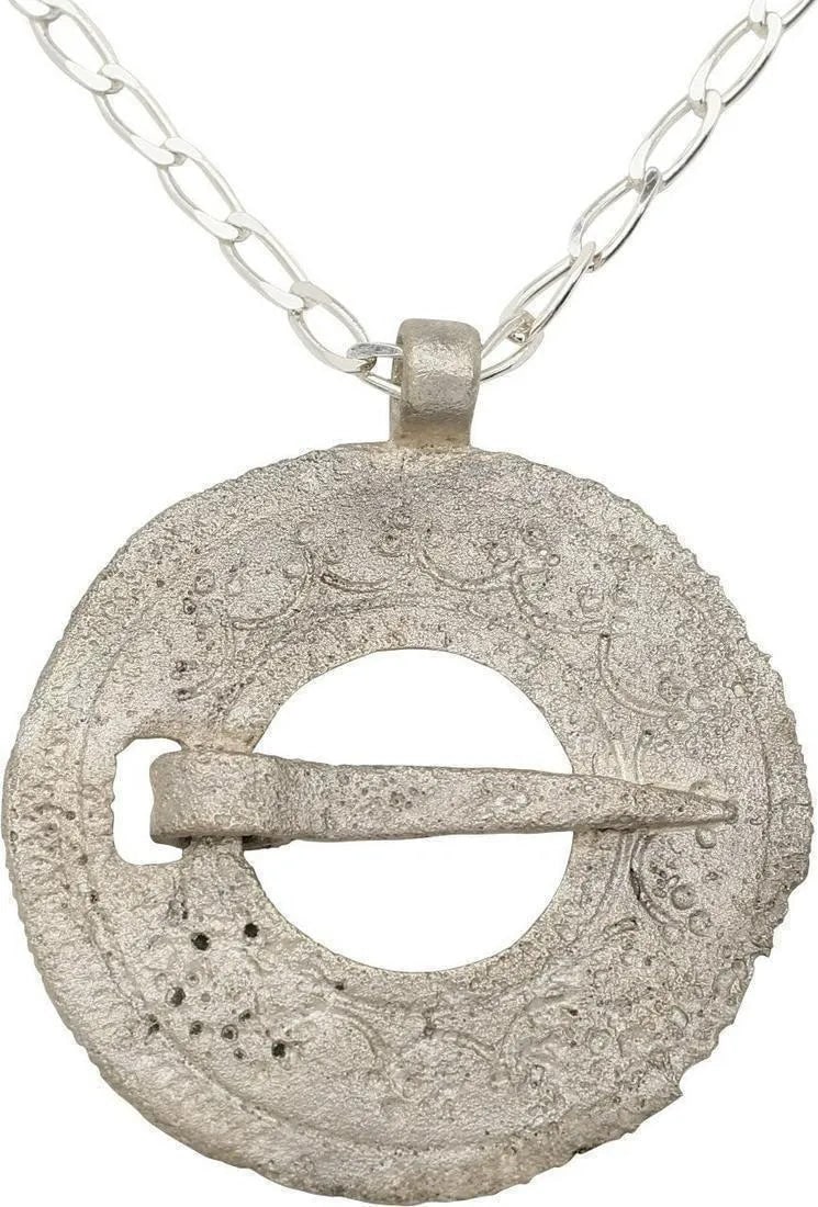 RARE VIKING PROTECTIVE BROOCH 10th-11th CENTURY AD: Bronze, 1 5/8” diameter of slightly domed form. Broadband with line edged hound’s tooth bands scalloped motif with triple dots at each cusp. Slotted for the captive cross pin. Worn in mult