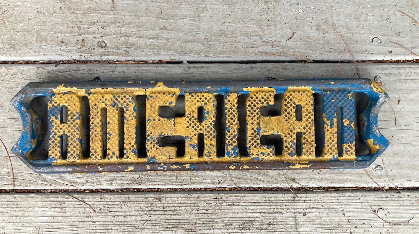 Mid 20thc AMERICAN cast iron ladder step with old blue and yellow paint