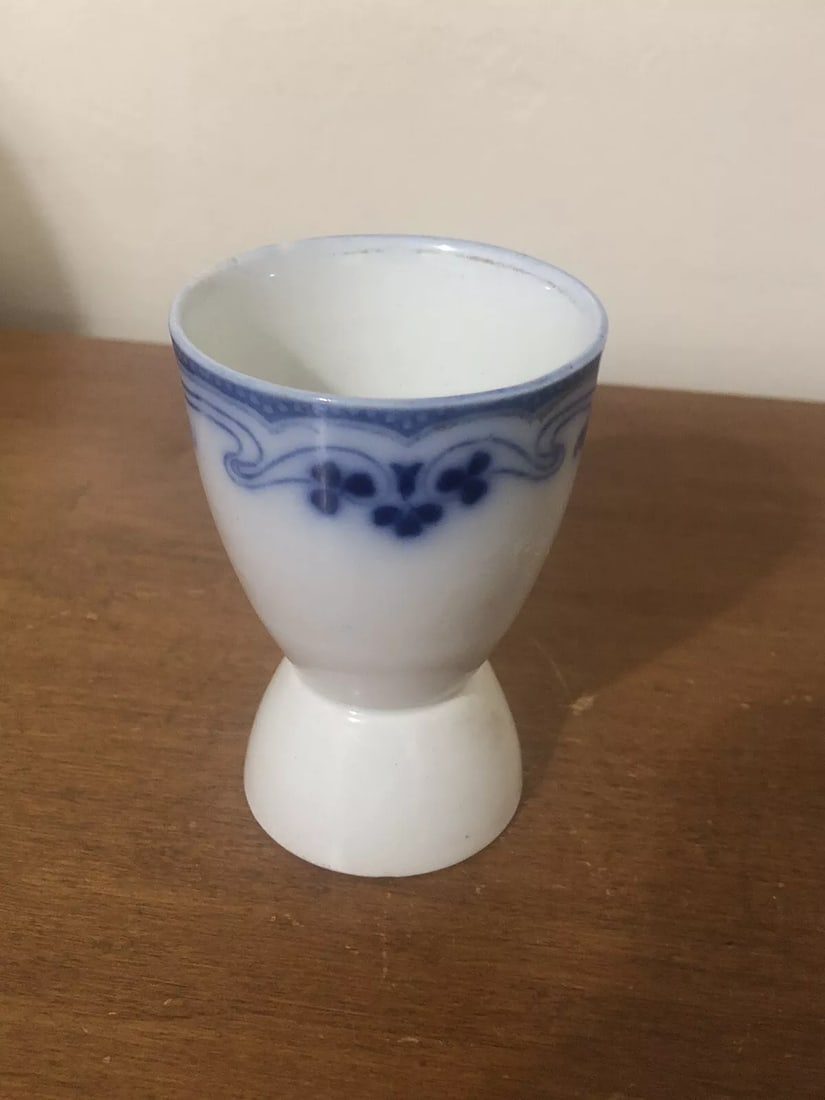 Idris Flow Blue Egg Cup: It measures 3 5/8” x 2 3/8” and dates around the 1860’s. It has a small flake on the base rim. Otherwise it has no other issues Shipping: Domestic: Flat-rate of $15.00 to anywhere wi