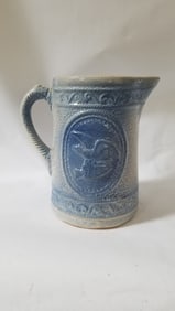 Stoneware blue and white pitcher with rare eagle