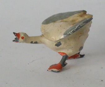 Antique cast metal Putz honking goose.