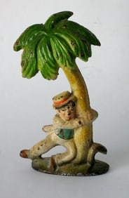 Vintage cast iron drunk at the Palm tree bottle opener.