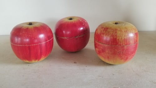Three painted wooden apple candy containers,  marked Japan