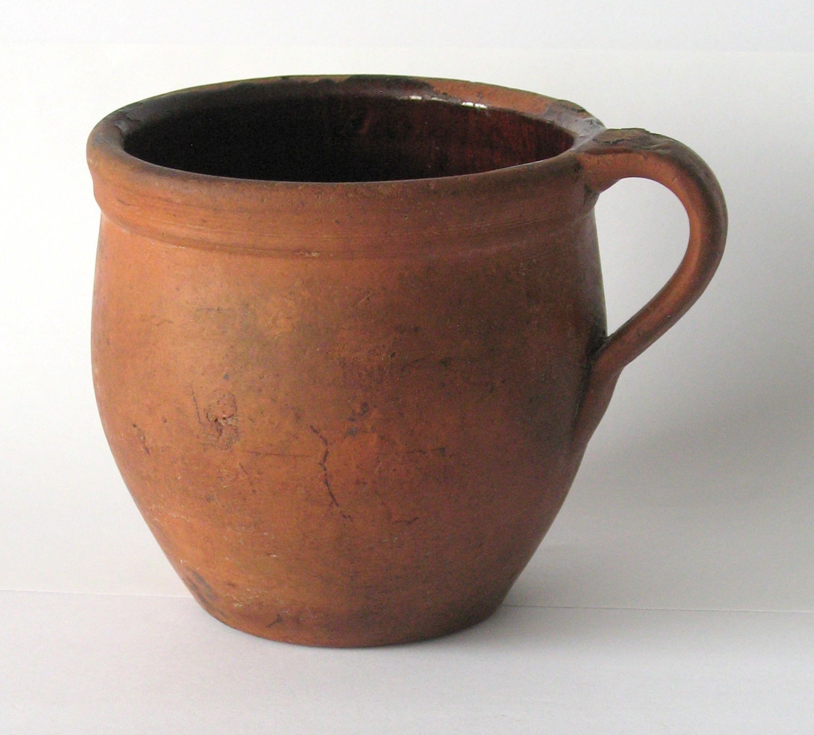 Antique Pennsylvania redware apple butter crock.: Title: Antique Pennsylvania redware apple butter crock. Date/Period: 1800's Dimension: 6 1/2” x 5” high Additional Information: Nice antique Pennsylvania redware apple butter crock with ha