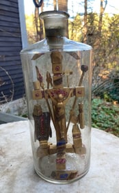 Late 1800’s hand blown bottle with wooden folkart scene of Christ on the crucifix at Calvary