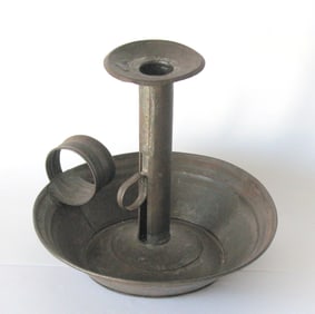 Antique Tinsmith made chamber stick.