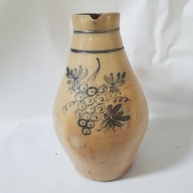 Highly decorated stoneware pitcher produced by Macquoid, New York city, 1880s