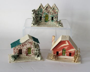 Group of antique Christmas village houses.