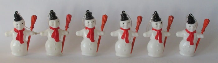 Group of vintage plastic snowman ornaments.