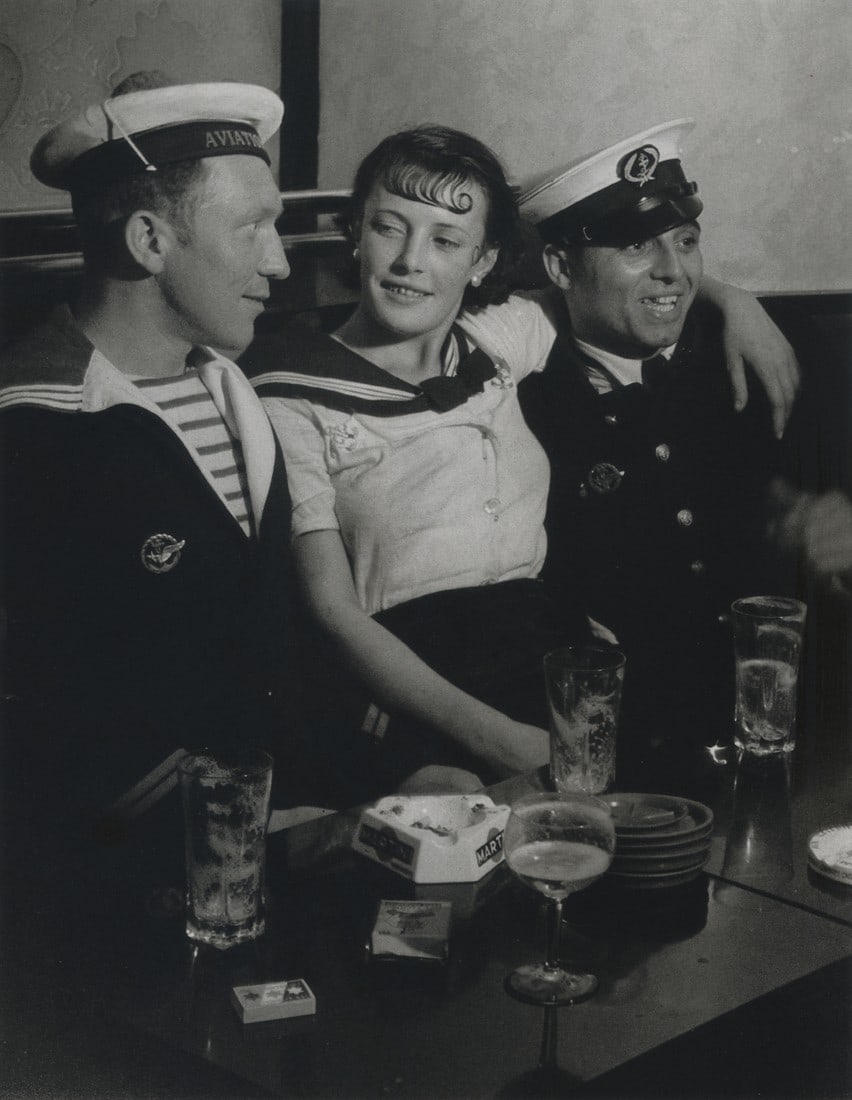 BRASSAI - Conchita With Sailors, Paris, 1933: Artist: Brassai Title: Conchita With Sailors, Paris, 1933 Medium: Photo Litho, 2008, China Dimensions: 6.5x8.4" Description: Heat Wax Mounted on 8.5x11" Conservation Board Artist Bio: Brassai was a Hu