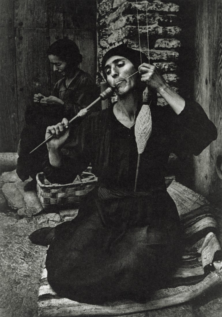 W. EUGENE SMITH - A Woman Spinning, Spain, 1951: Artist: W. Eugene Smith Title: A Woman Spinning, Spain, 1951 Medium: Sheet Fed Gravure, 1989, Switzerland Dimensions: 5.65x8.05" Description: Heat Wax Mounted on 8.5x11" Conservation Board Artist Bio: