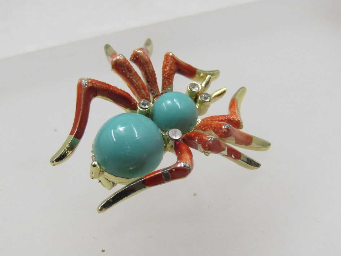 Vintage Enameled Spider Brooch, Rhinestones, 1960's, 1.5": Vintage Enameled Spider Brooch, Rhinestones, 1960's, 1.5". Orange enameled legs, the color of cooked crab with turquoise acrylic cabochon torso and rhinestones for the eyes and between the turquoise c