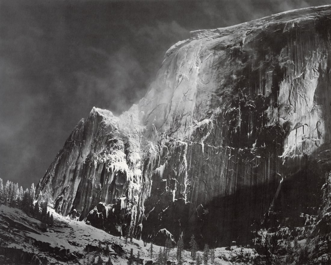ANSEL ADAMS - Half Dome, Blowing Snow, Yosemite 1955: Artist: Ansel Adams Title: Half Dome, Blowing Snow, Yosemite National Park, California, 1955 Medium: Photo Litho, 1974, USA Dimensions: 14.5x11.6" Description: Heat Wax Mounted on 14x18" Conservation 