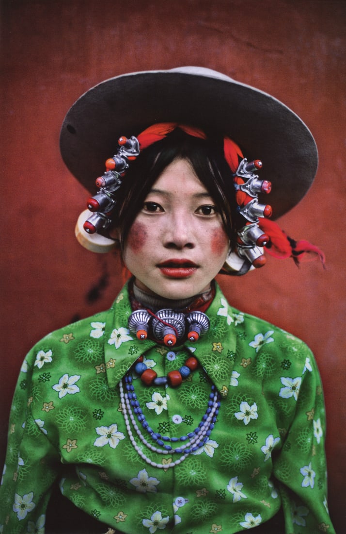 STEVE MCCURRY - Woman at a Horse Festival, Tibet: Artist: Steve McCurry Title: Woman at a Horse Festival, Tagong, Tibet, 1999 Medium: Photo Litho, 2012, Italy Dimensions: 9.1x14" Description: Heat Wax Mounted on 14x18" Conservation Board Artist Bio: