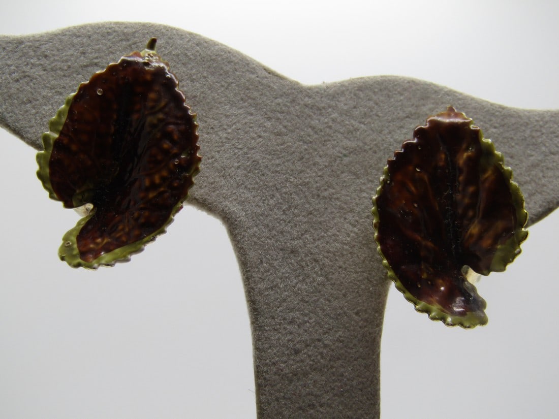 Vintage Coro Enameled Leaf Earrings, Clip, 1960's: Vintage Coro Enameled Leaf Earrings, Clip, 1960's. 1.25" long and 3/4" wide with brown enameled on the main part of the leaf and green edges. The earrings a set deeper in the center. Gold tone and sig