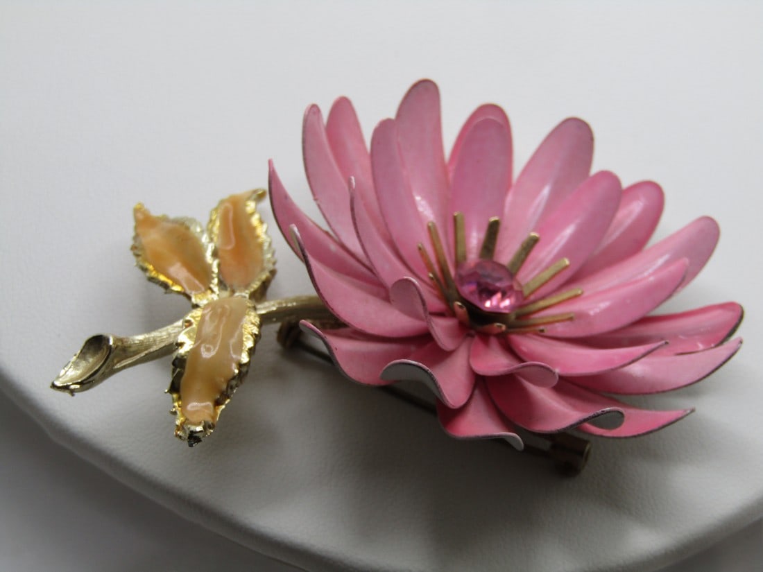 Vintage Coro Pink Floral Stem Brooch, 1940's, Rhinestone: Vintage Coro Pink Enameled Floral Stem Brooch, 1940's, Rhinestone. This has curved petals that curl upward with an 8mm pink rhinestone center and gold tone pronged halo around the stone. The stem is a
