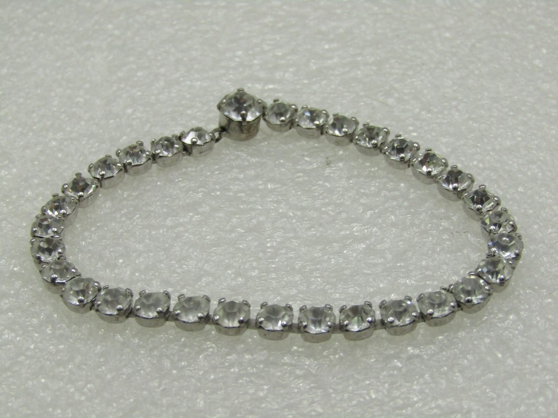 Vintage Coro Sterling Rhinestone Bracelet, 6.75", 1940's: Vintage Coro Sterling Rhinestone Bracelet, 6.75", 1940's. Appx. 4mm wide made up of 4mm round clear rhinestones, including the box clasp which is round and has a larger clear stone that is appx. 5mm w