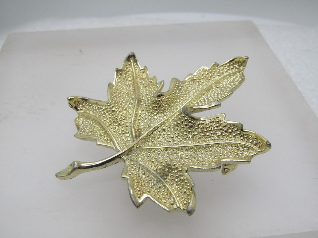 Vintage Coro Leaf Brooch, 1960's, Gold Tone: Vintage Coro Leaf Brooch, 1960's, Gold Tone. It is appx. 2.5" tall and 2" wide. It is signed Coro on the back. Light wear and good to very good condition. (W8523.5 SS11636 J LD 8/18/23). Reserve: $30.