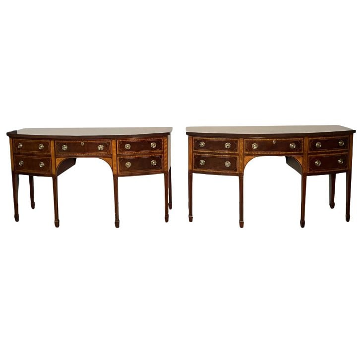 Pair of Baker Mahogany Satinwood Sideboards, Historic Charleston, Bow Front: Baker Mahogany Satinwood Sideboards or Credenzas, 'Historic Charleston Collection', Bow Front Fine condition. Pair of fully refinished Baker Furniture Console Tables featuring inlaid wood and classica