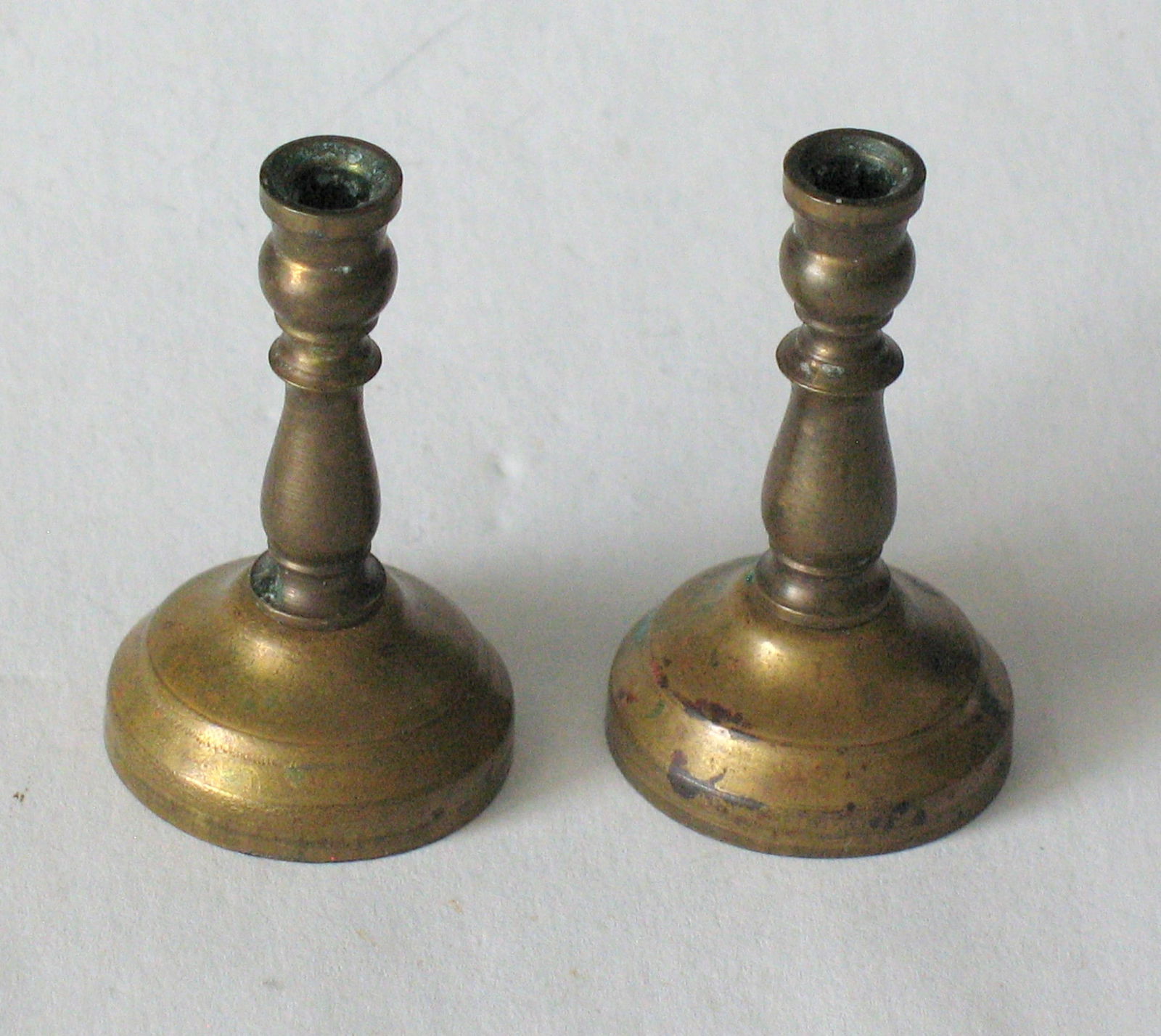 Pair of miniature brass candle sticks. (1 of 3)