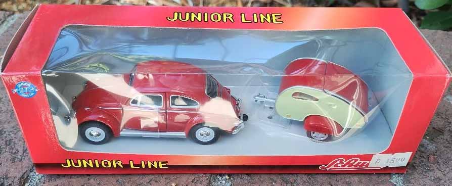 Schuco Junior VW Beetle and trailer,c10.: Schuco Junior VW Beetle and trailer,c10. Reserve: $47.00 Shipping: Domestic: Flat-rate of $15.00 to anywhere within the contiguous U.S. International: Flate rate of $32.00. International shipping may