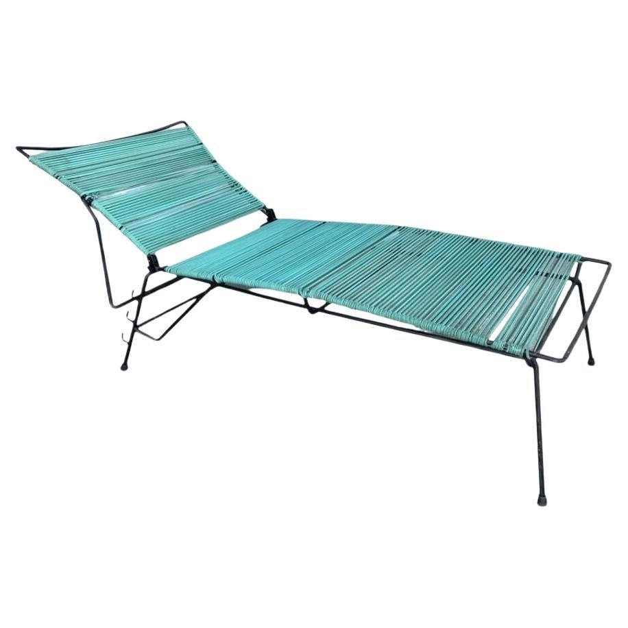Mid Century Iron Outdoor/Patio Chaise Lounge with Teal Cord: About the Item White steel outdoor / patio chaise lounge, produced in 1960 by the Woodard Furniture Company. This comfortable and stylish vintage chaise lounge features a fully adjustable reclining ba