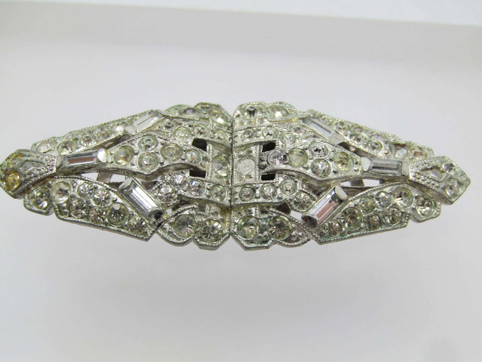 Vintage Coro Duette, Rhinestone, 1930's-1940's: Vintage Coro Duette, Rhinestone, 1930's-1940's. The duettes come apart by slipping the sides out of the frame that connects them to be a brooch and then they can be worn as a dress clip. This unfortun