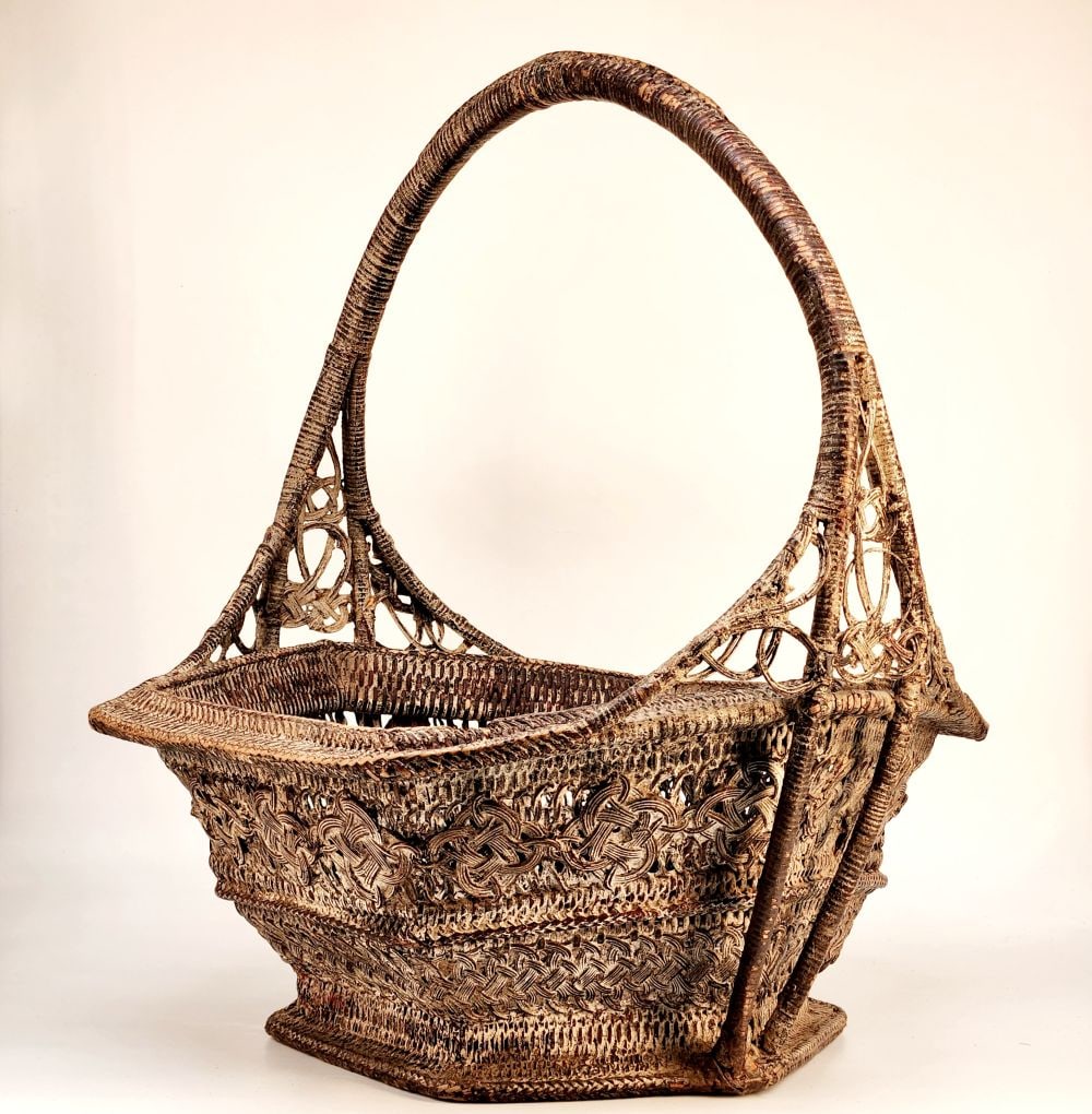 Burmese Woven Basket: Description: Burmese antique woven basket with thin strips of split bamboo. Made as a household item for the Europeans during the late 19th century. Vestiges of the original coloring (white) which has