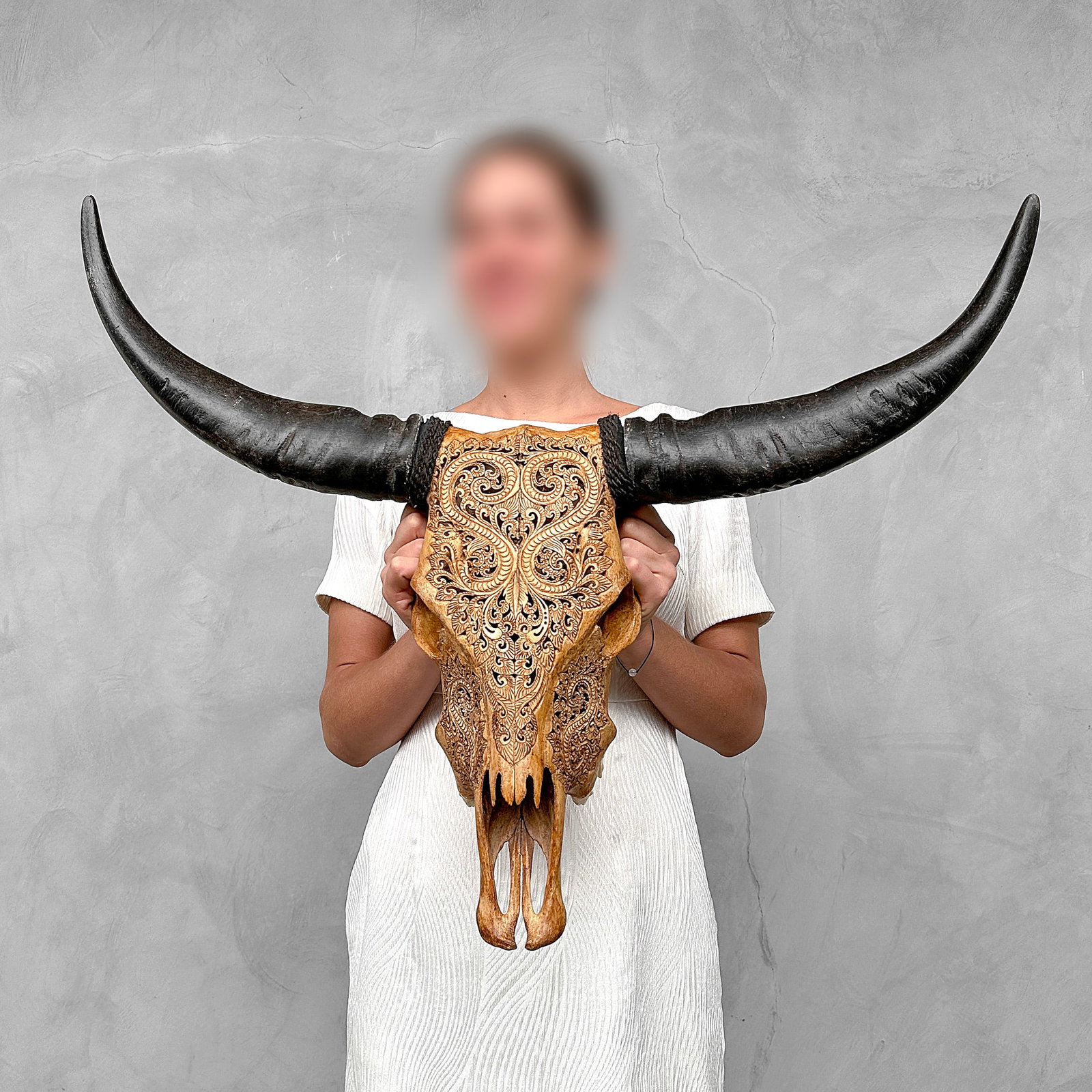 This brown carved buffalo skull is a stunning home décor object that enlivens any home or: Title: This brown carved buffalo skull is a stunning home décor object that enlivens any home or restaurant. More than just a spiritual and cultural piece of art; it also tells the story of Indonesia
