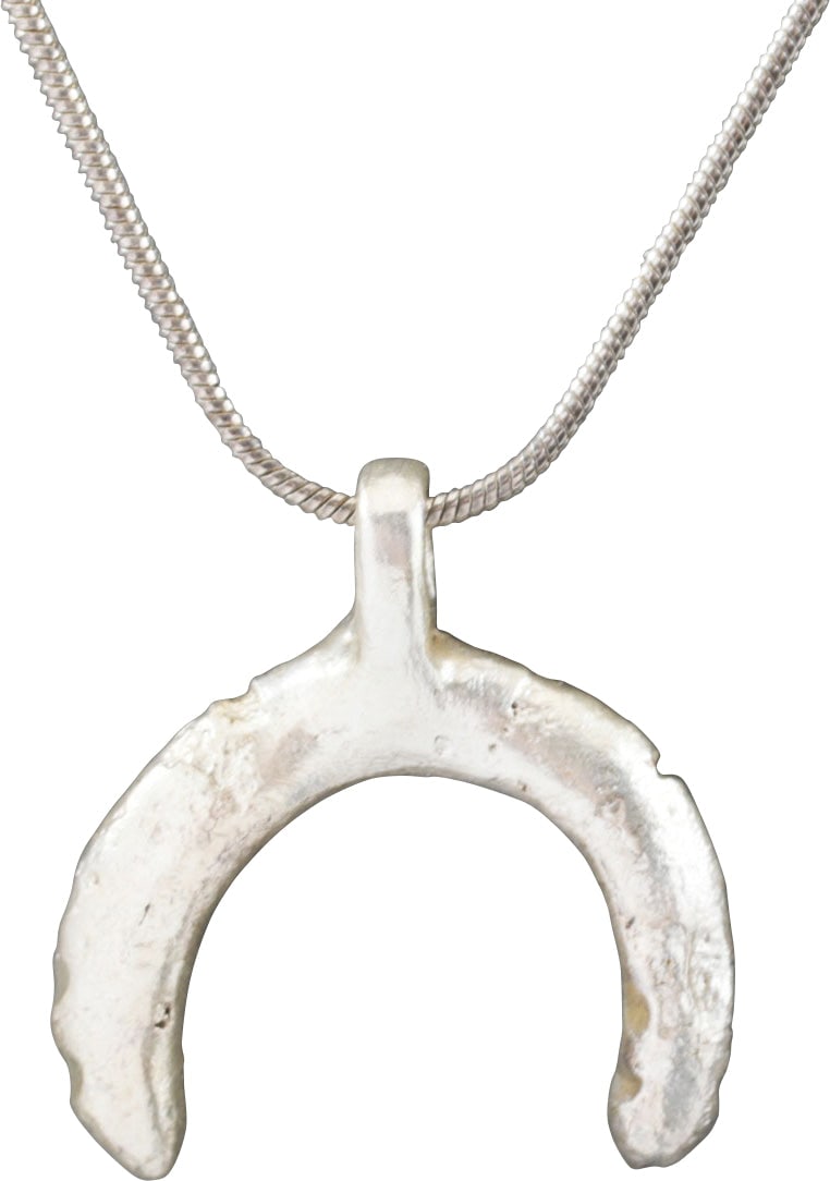 VIKING LUNAR PENDANT NECKLACE, C.950-1050 AD: Small example, just under 1” total height. As expert navigators, the constellations signified mystery and power to Vikings. The Moon was personified as Mani, brother to Sol the Sun, and is abund