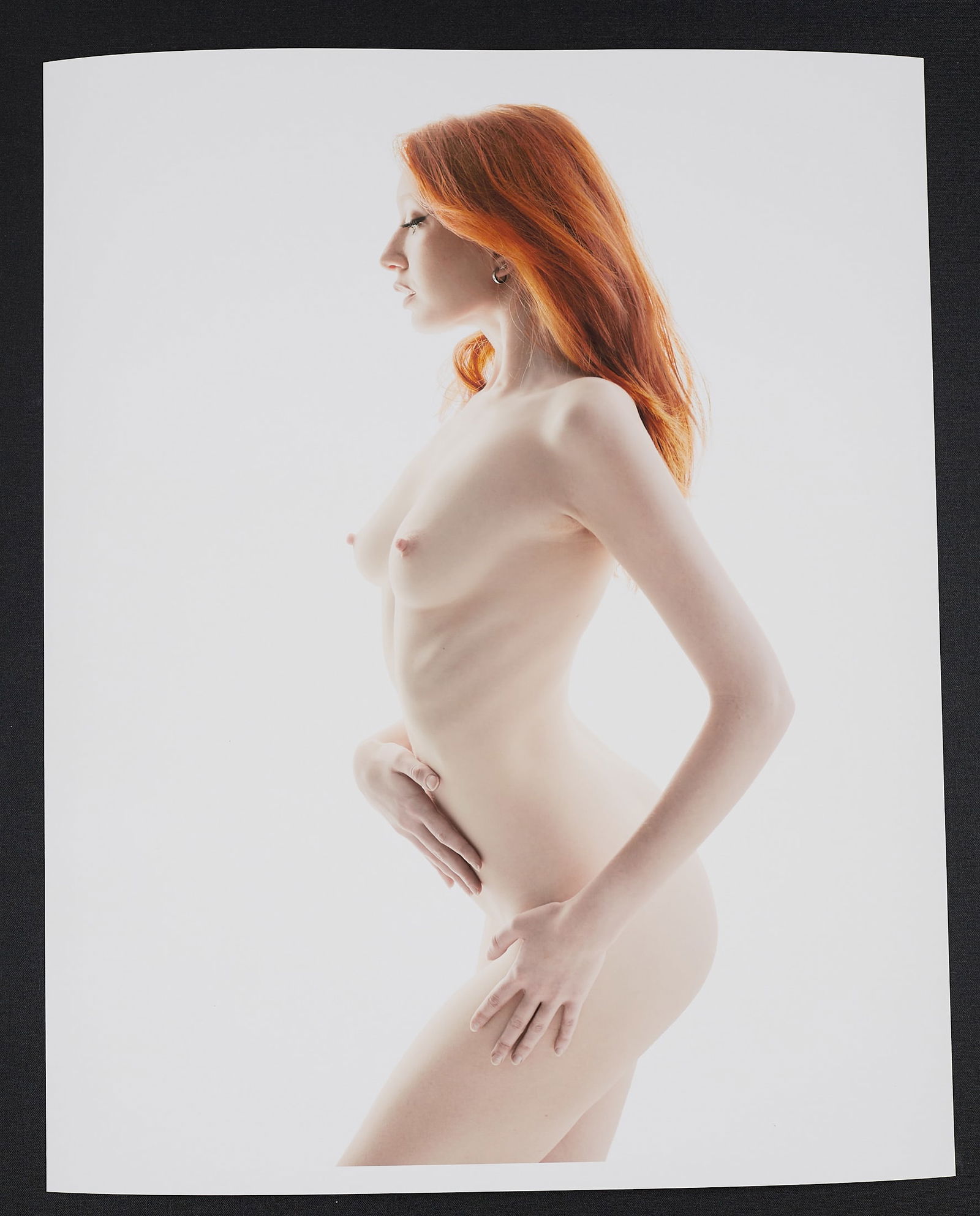 Spiros Politis(1969-): Alabaster Redhead: Artist: Spiros Politis(1969-) Title: Alabaster Redhead Date/Period: 2022 Practice: photography Size: 20" x16" Edition 7/25 . Alabaster Redhead"(2022) This gorgeously pale minimal high key figure portr