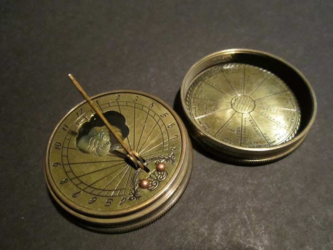 Brass Timekeeping Sundial with Top Pocket Compass Watch: 2" Round Nice reproduction of an antique sundial, compass with lid referenced in several antique reference books. See "Collectors Illustrated Encyclopedia of The American Revolution" by George Neumann