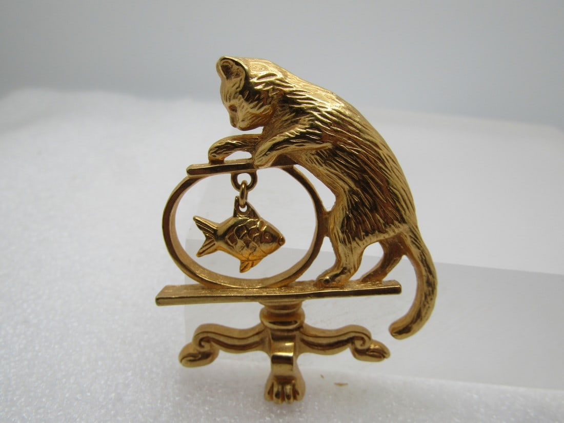 Vintage Cat on Table With Fish Bowl Brooch, Avon, 1980's: Vintage Cat on Table With Fish Bowl Brooch, Avon, 1980's. Gold tone very cute brooch of a cat standing on a table watching the swimming fish in the bowl which dangles in the center of the fishbowl. It