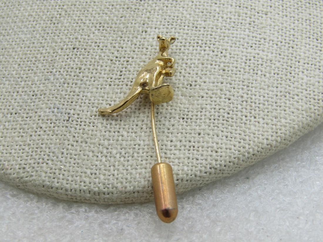 Vintage Gold Tone Kangaroo Stick Pin, 1.75": Vintage Gold Tone Kangaroo Stick Pin, 1.75" with safety cap. Not signed by the maker. There is one little area of surface wear on the pin. Good condition. (INV. W. 3720.1 SS1055 NL LD 4/8/20) Reserve: