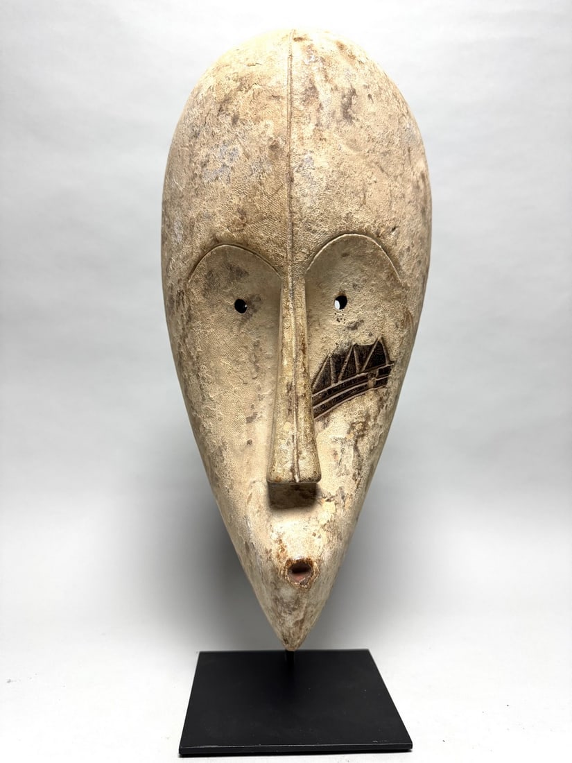 White Fang - Ngil mask - Gabon, Africa: These masks were used by the male NGIL society that no longer exists today. This secret society was responsible for the initiation and they fought against witchcraft. The Ngil had a ritual purifying f