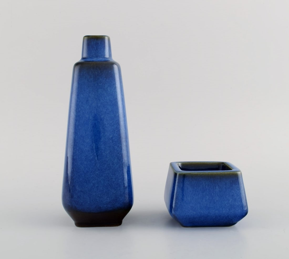 Sven Jonson for Gustavsberg. Lagun vase and bowl in glazed stoneware. Beautiful glaze in shades of: Sven Jonson for Gustavsberg. Lagun vase and bowl in glazed stoneware. Beautiful glaze in shades of blue. 1960s. The vase measures: 20.5 x 8 cm. In excellent condition. Stamped. Reserve: $259.00 Shippi
