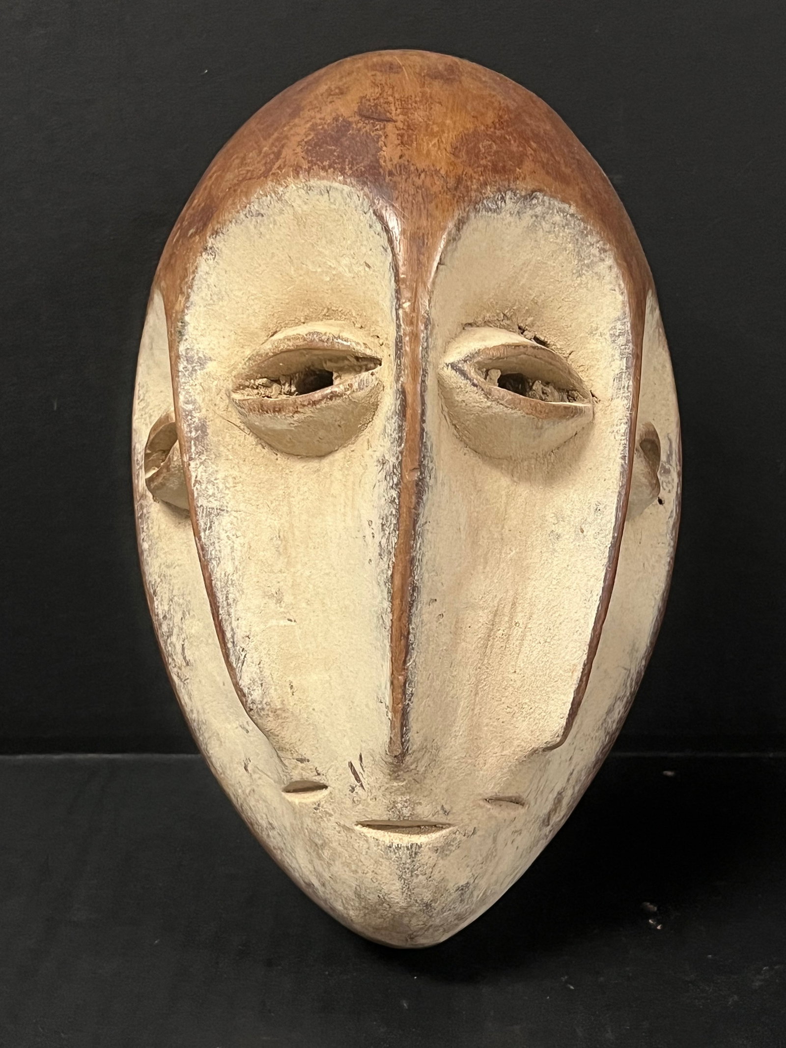 African Tribal Art Lega Mask: Title: African Tribal Art Lega Mask Date/Period: Late 20th Century Dimension: 10" h x 6" w Material: Wood Additional Information: African Tribal Art Lega Mask Reserve: $80.00 Shipping: Domestic: Flat-