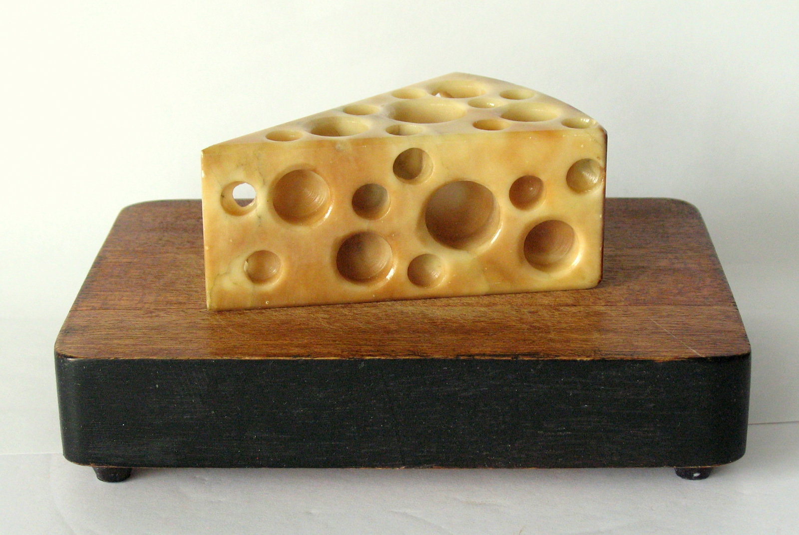Antique piece of stone Swiss cheese.: Title: Antique piece of stone Swiss cheese. Date/Period: 1940's Dimension: 4” x 2 3/4” x 2” high Additional Information: Nice piece of antique stone Swiss cheese in great original pa
