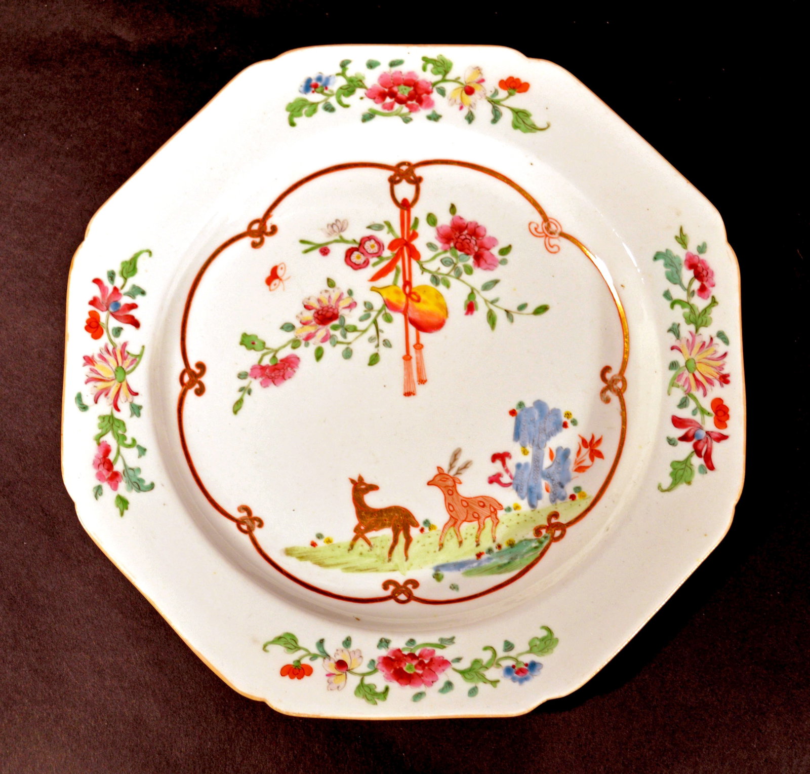 Antique Derby Porcelain Chinoiserie Plate, Circa 1810.: The octagonal Derby porcelain replacement plate is painted in the Chinese Yongzheng style with deer in a landscape surrounded by a gilt, scallop link border supporting a pendent bouquet of flowers. Fo