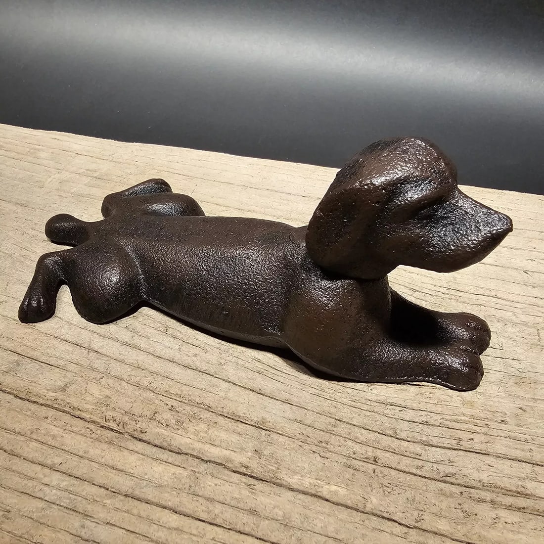 Cast Iron Dog Door Stop Wedge Rust/Black: 6" Long x 3 1/2" Wide Nice Reproduction antique solid cast iron rust/black dog door wedge. This dog is much thicker, and heavier then other similar ones we have seen. Please see the images, this item 