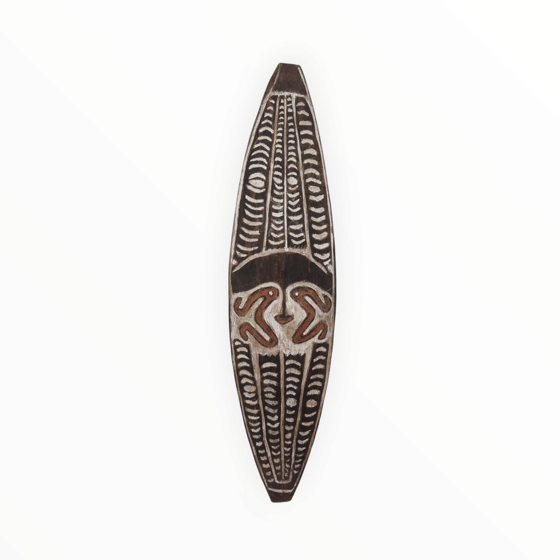 New Guinea shield: Title: New Guinea shield Date/Period: 19th Century Materials/Origin: Wood / New Guinea Dimension: 38in X 10in Description: There are many different styles of Tribal Shields from Papua New Guinea. They